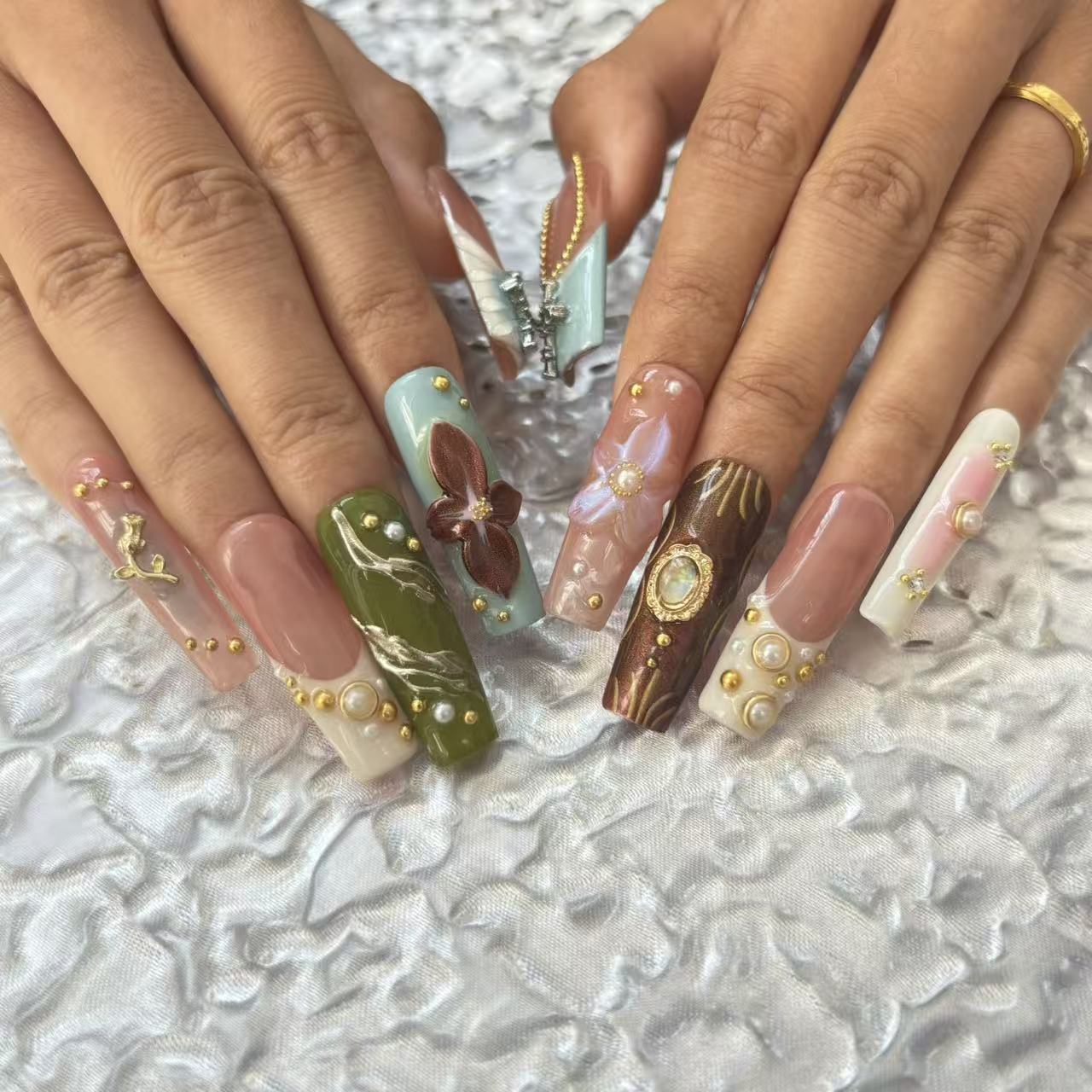 Exquisite Handmade Multicolored Nail Art with Floral and Gemstone Embellishments