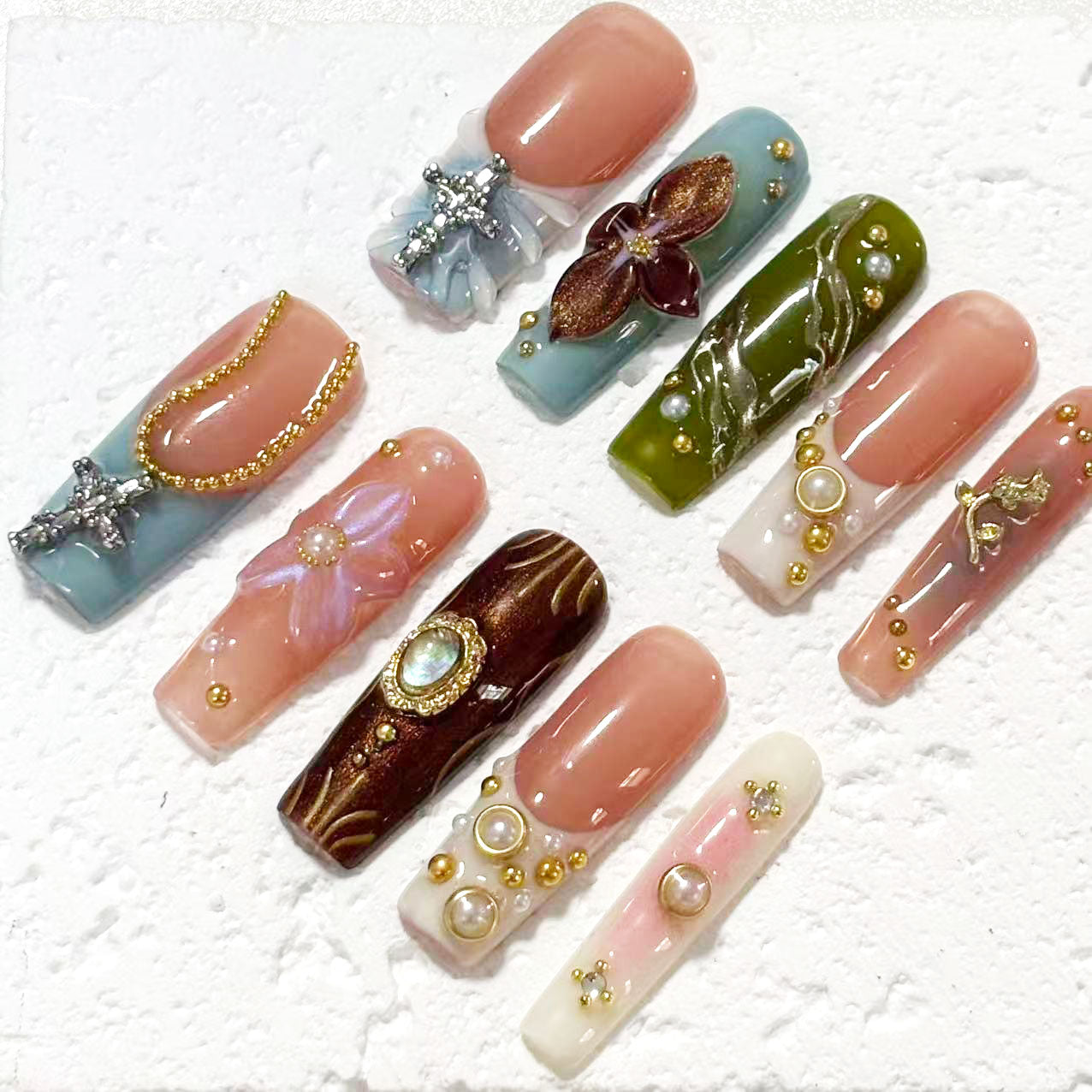 Exquisite Handmade Multicolored Nail Art with Floral and Gemstone Embellishments