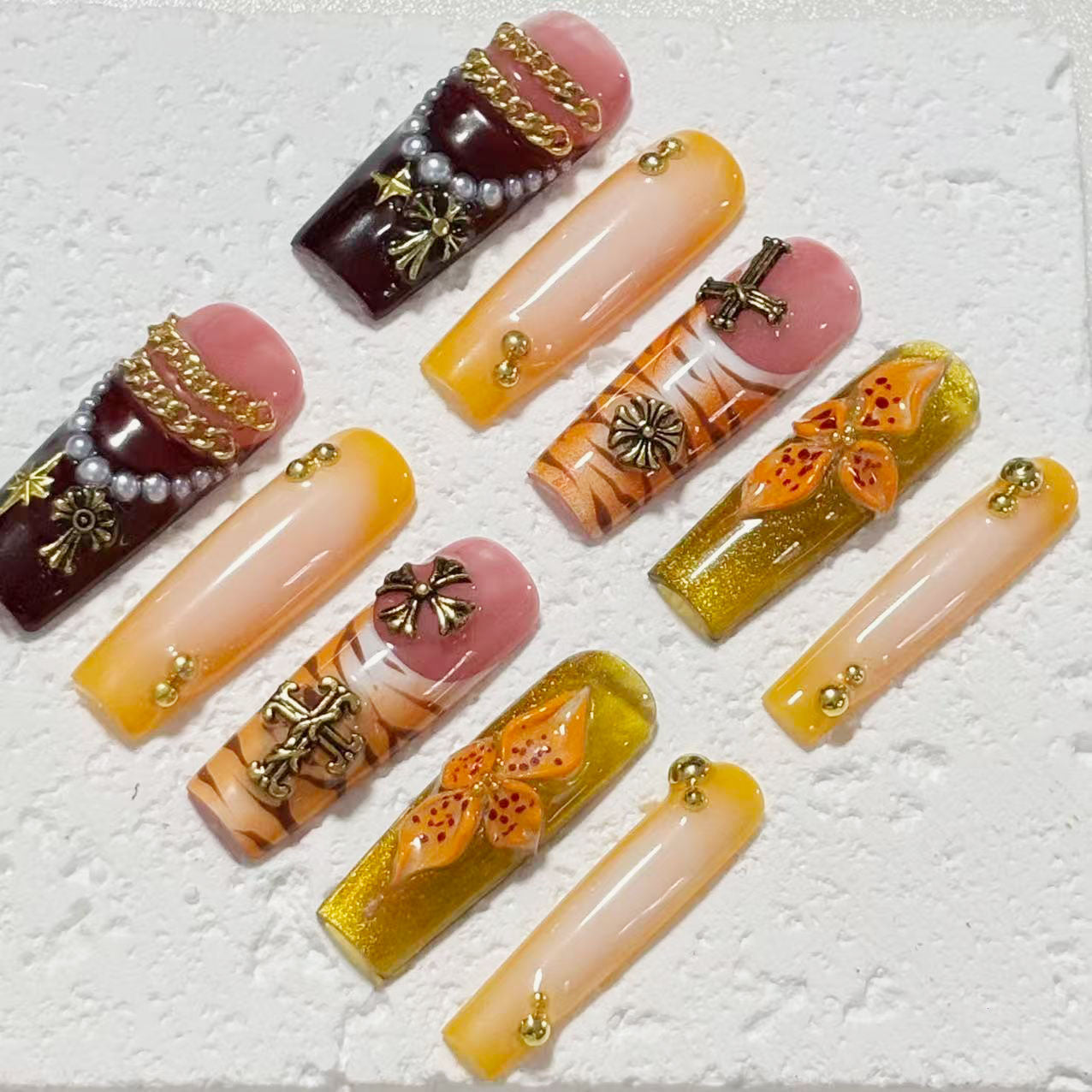 Exquisite Handmade Nail Art: Colorful Fusion with Cross, Flower & Chain Embellishments